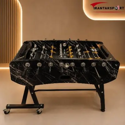 فوتبال دستی مدل S12 مشکی با رگه های روشن و آدمک های طلایی و نقره ای، نمای روبه رو - تصویر اصلی